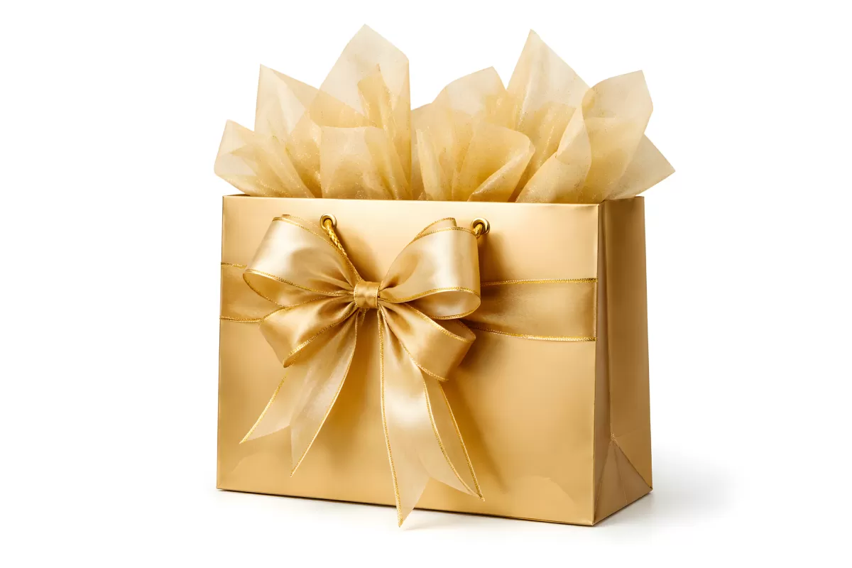 Goldene Geschenktüte mit Schleife und Seidenpapier