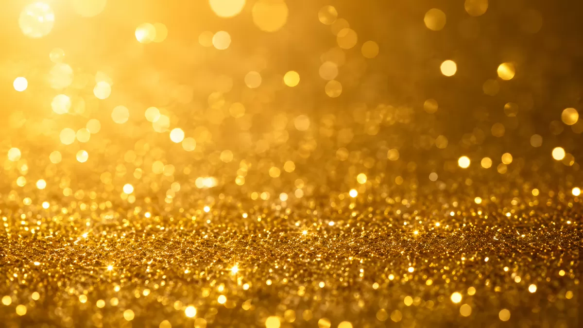 Goldenes Glitzer-Bokeh mit funkelnden Lichtpunkten