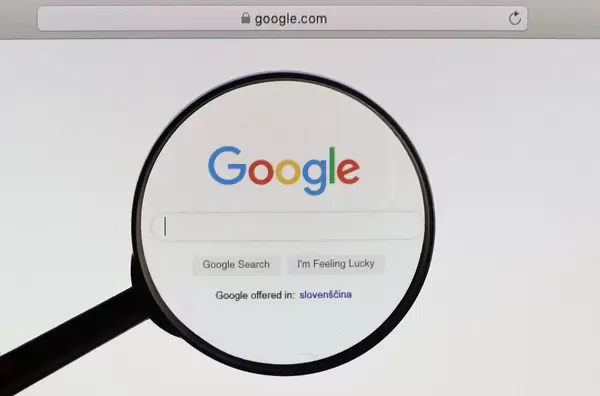 Google logo under magnifying glass