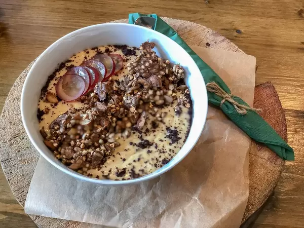 Granola with yoghurt: green buckwheat, almond, dried apricots, coconut milk, banana, granola