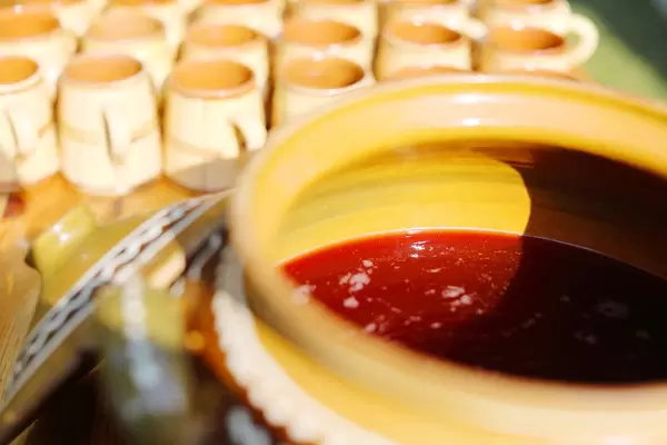 Grape must in ceramic pot