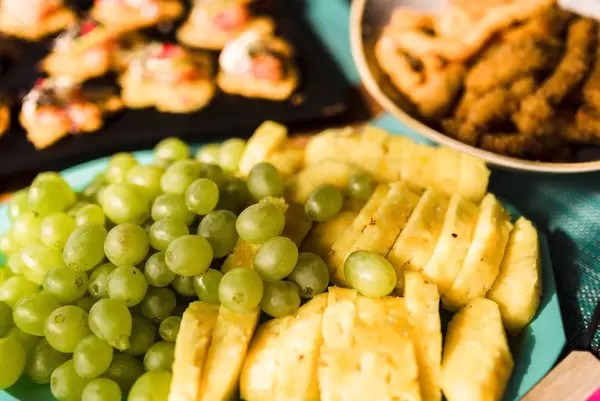 Grapes And Pineapple On Blue Dish