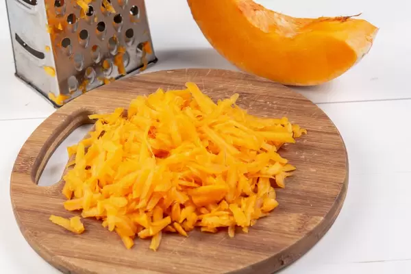 Grated Fresh Raw Pumpkin on the wooden board (Flip 2019)