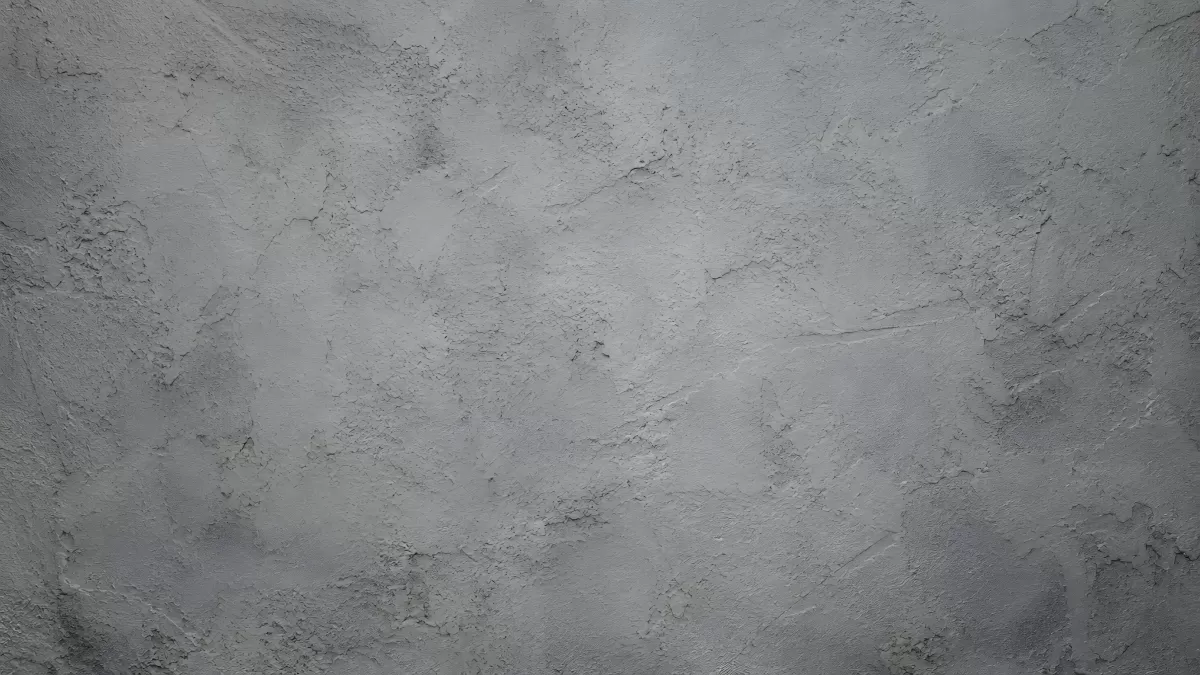 Graue Betonwand mit rauer Putzstruktur als Hintergrund