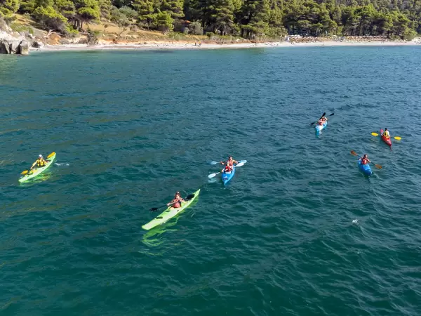 Greece holidays in summer 2021: tourists on six kayaks at Kastani Beach, Skopelos