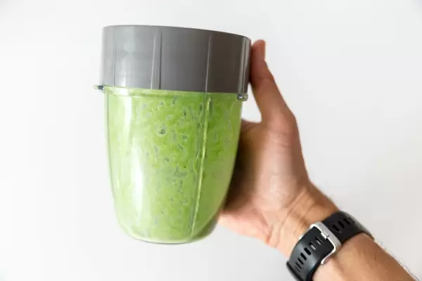 Green healthy protein drink made of spinach and almond powder