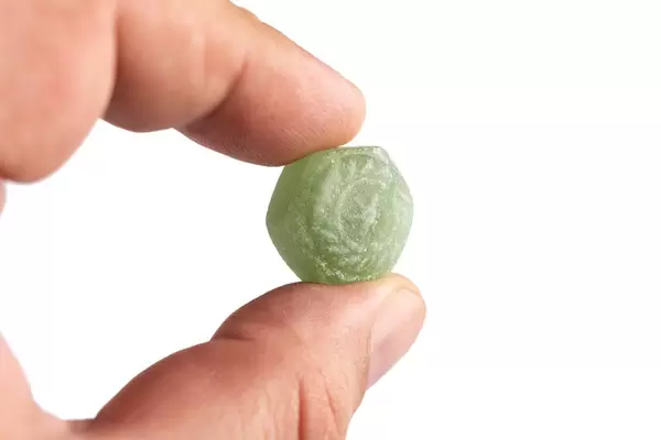 Green Menthol Candy in the hand