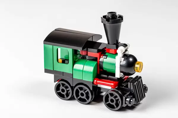 Green plastic train on a white background (Flip 2020)
