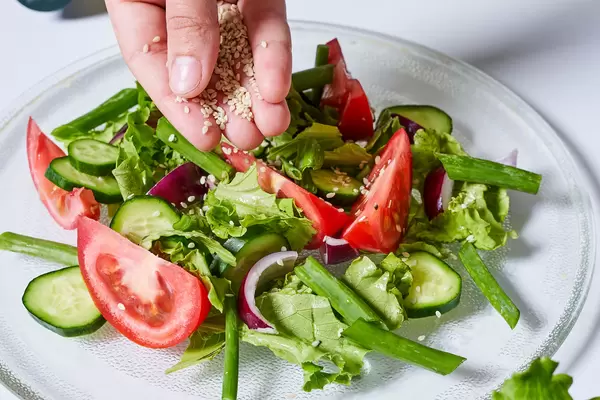 Green salad from leaves and tomatoes