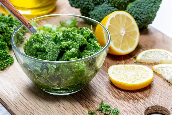 Green sauce with fresh herbs with vegetables in a glass bowl closeup. The concept of healthy eating (Flip 2019)