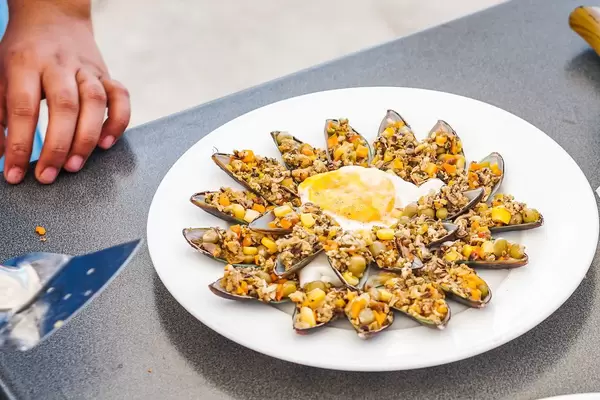 Green shell dish with ground beef and egg