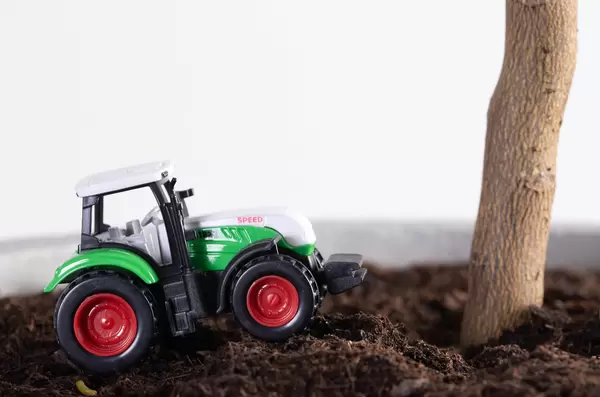 Green tractor at field