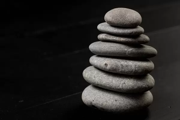 Grey Balanced Stones on the black background