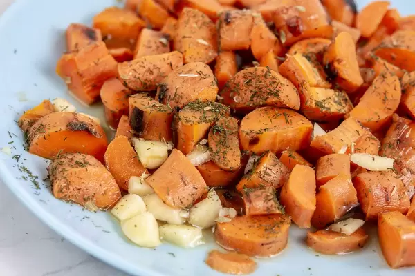 Grilled Carrots sliced with Garlic and served