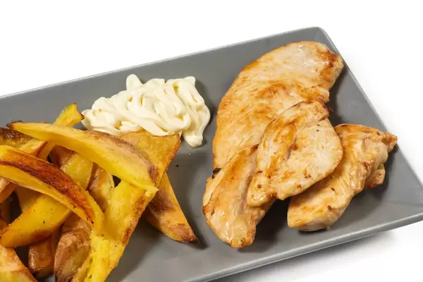 Grilled Chicken White Meat with French Fries above white background