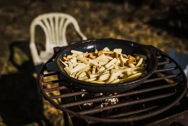 Grilled Potoatoes On Iron Pan On Fire