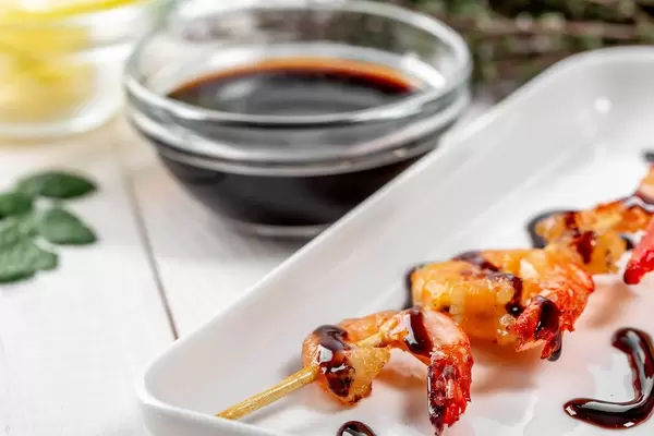 Grilled shrimp on a skewer with sauce
