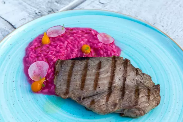 Grilled tuna with beetroot risotto and sweet-lemon foam
