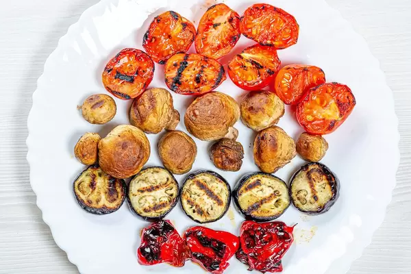 Grilled vegetables on a white plate. Top view