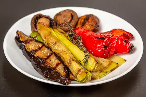 Grilled vegetables on a white plate
