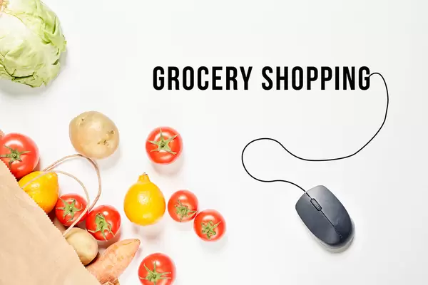 Grocery shopping concept with fresh vegetables and PC mouse