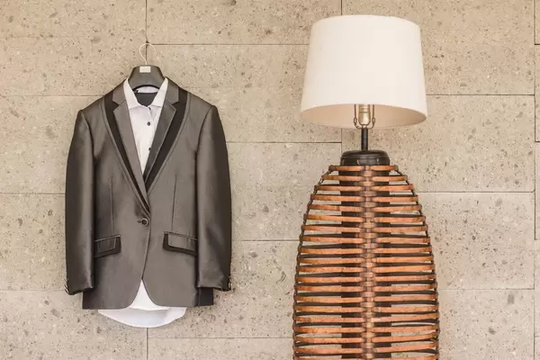 Groom's Suit hanging next to a lamp  Flip 2019
