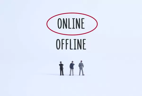 Group of businessman with Online and Offline text