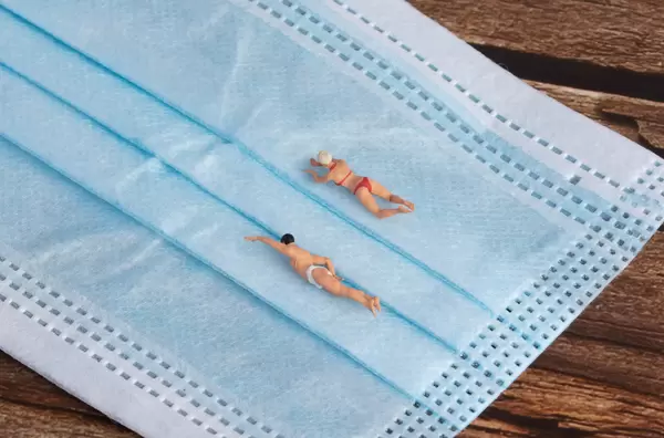 Group of friends swimming together in the pool