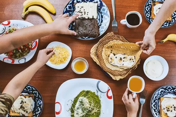 Group of people having breakfast