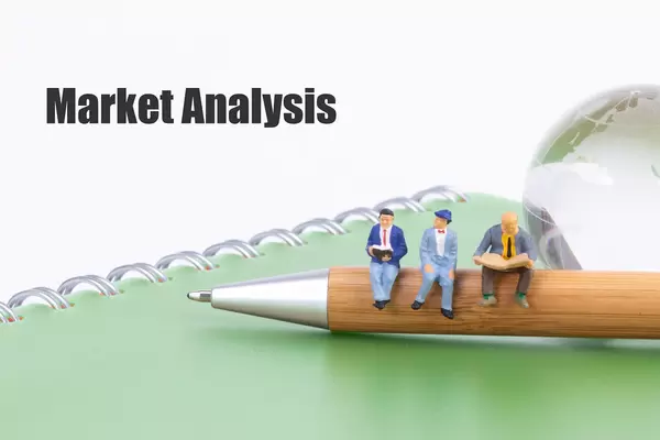 Group of people sitting on a pen with Market Analysis text