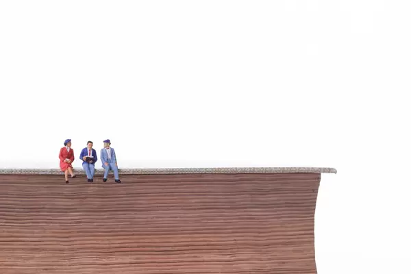 Group of people sitting on book