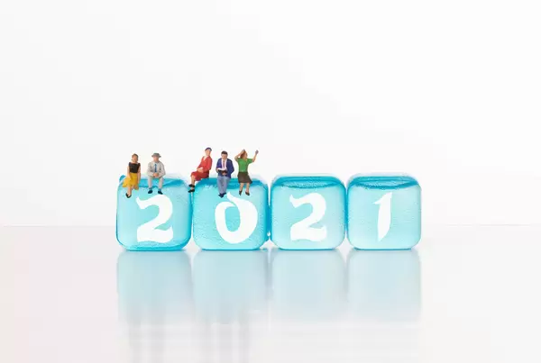 Group of people with blue ice cubes and 2021 text