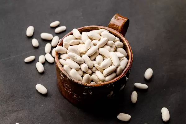 Group of white beans in a ceramic cup