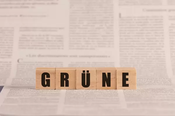 Grüne written with cubes on a newspaper