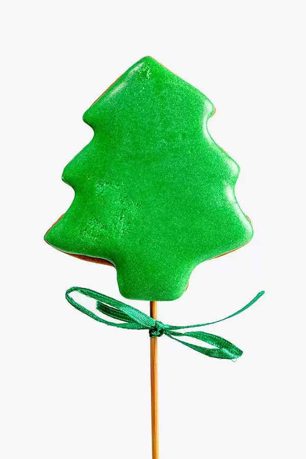 Grüner Weihnachtsbaum am Stab als Lebkuchen