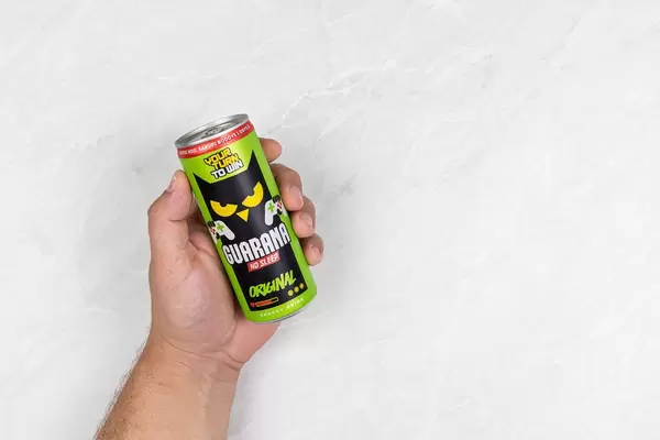 Guarana can in the hand with copy space