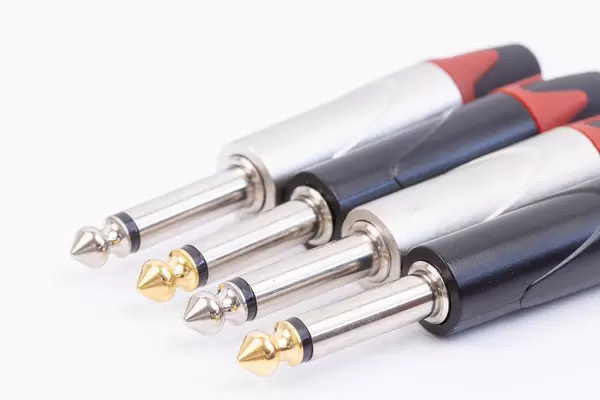 Guitar cable Jack connectors 1/4 with blurred background
