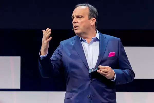 Hagen Rickmann, Director for Business Customers of the Deutsche Telekom and Digital X patron, gives a keynote speech on the stage of the Koelnmesse