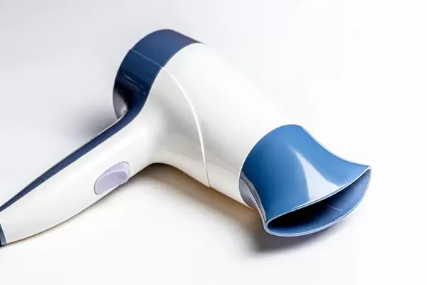 Hair dryer on white background