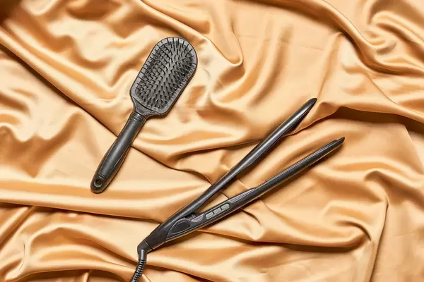 Hair iron and comb on textile