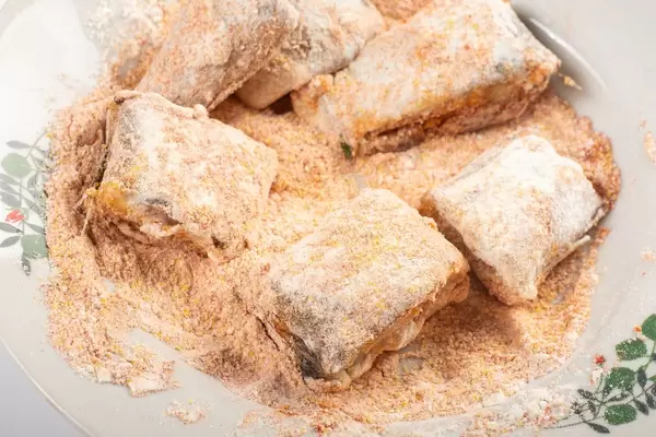 Hake Fish in the flour with red paprika