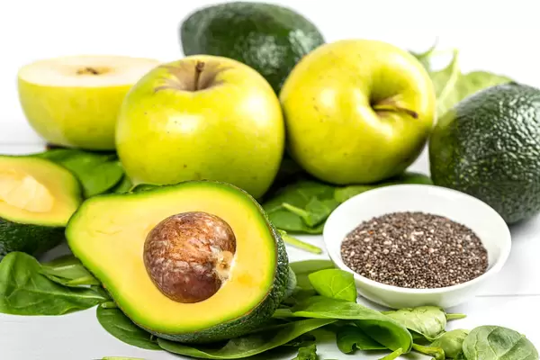Half avocado, fresh apples, spinach and chia seeds