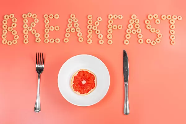 Half grapefruit on a plate, diet breakfast concept