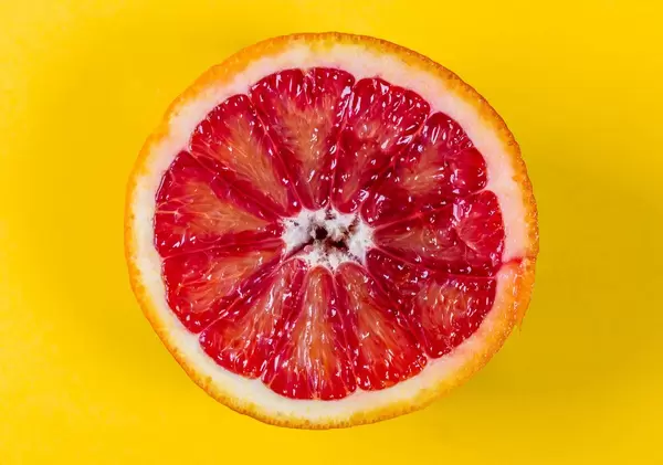 Half Moroccan orange on yellow background