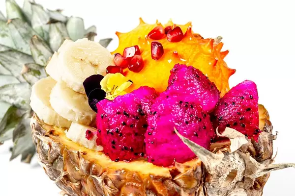 Half of a pineapple stuffed with different fruits (Flip 2020)