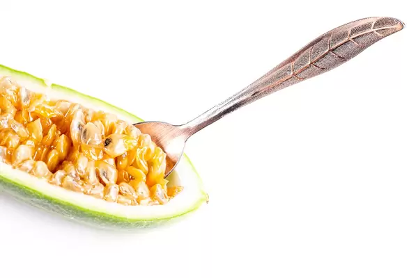 Half ripe curuba with spoon