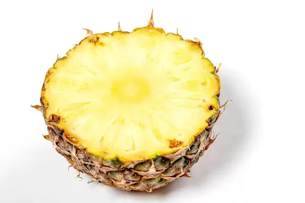 Half ripe fresh pineapple on white background (Flip 2019)