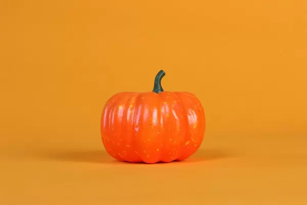 Halloween pumpkin decorations on a orange background