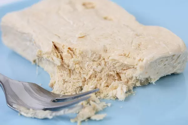 Halva candy with Vanilla with fork on the plate (Flip 2019)