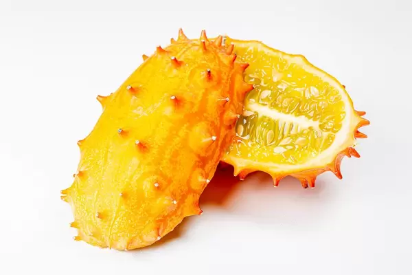 Halves kiwano fruit or horned melon on white background (Flip 2020)